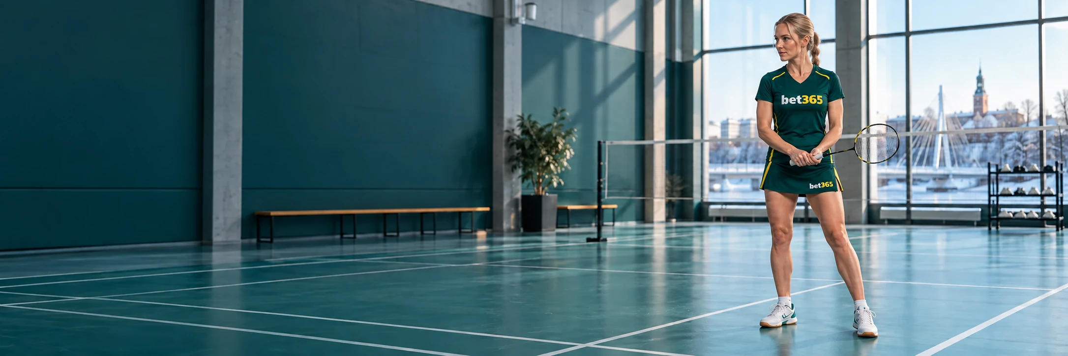 Badminton player on an indoor court wearing bet365 branding